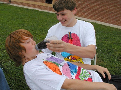 Students participating in the Bottle Burp-Off activity